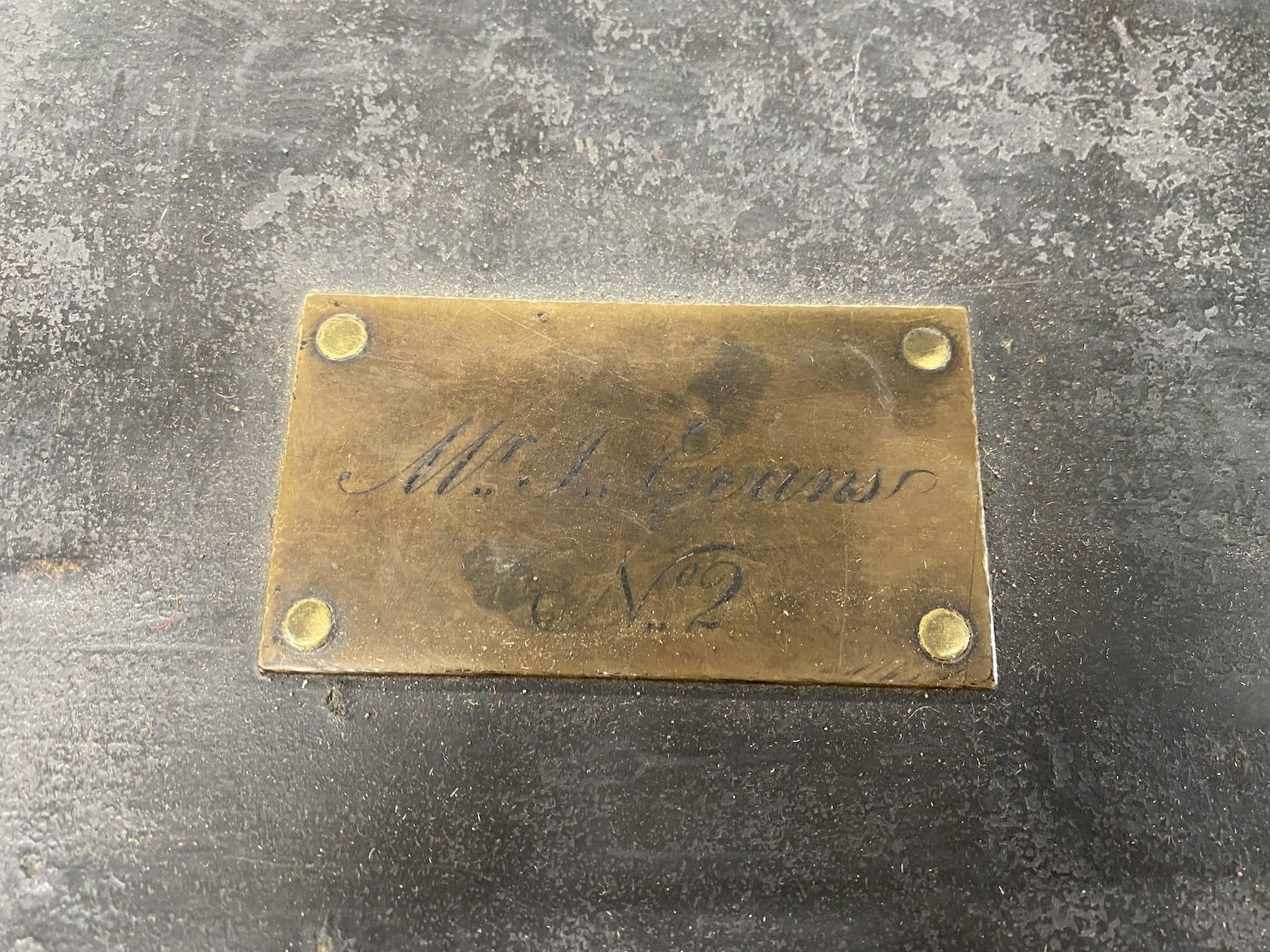 A Victorian studded black leather trunk, brass plaque inscribed Mr J Evans No. 2, width 107cm, depth 55cm, height 52cm